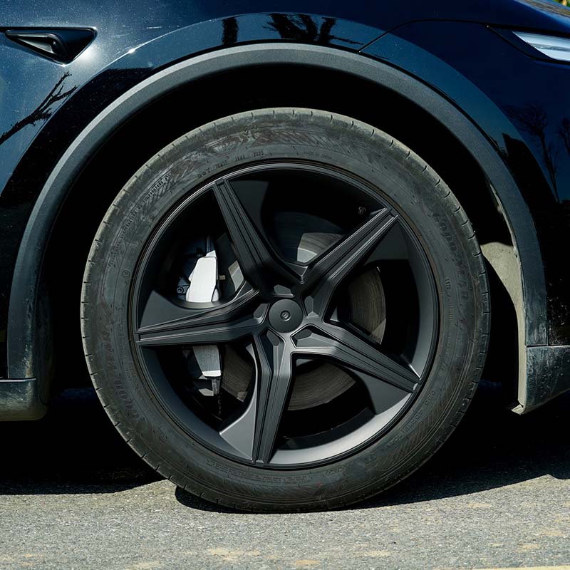 19-inch Starfish Style wheel cover installed on the rear wheel of Model Y
