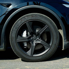 19-inch Starfish Style wheel cover installed on the rear wheel of Model Y