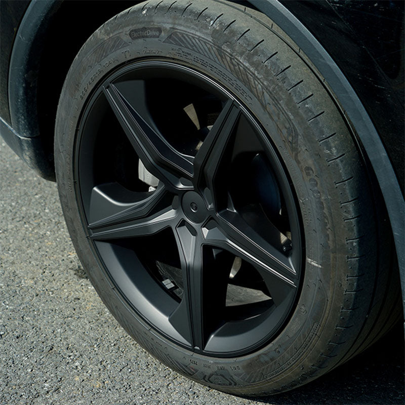 Close-up of the 19-inch Starfish Style wheel cover fitted on Model Y