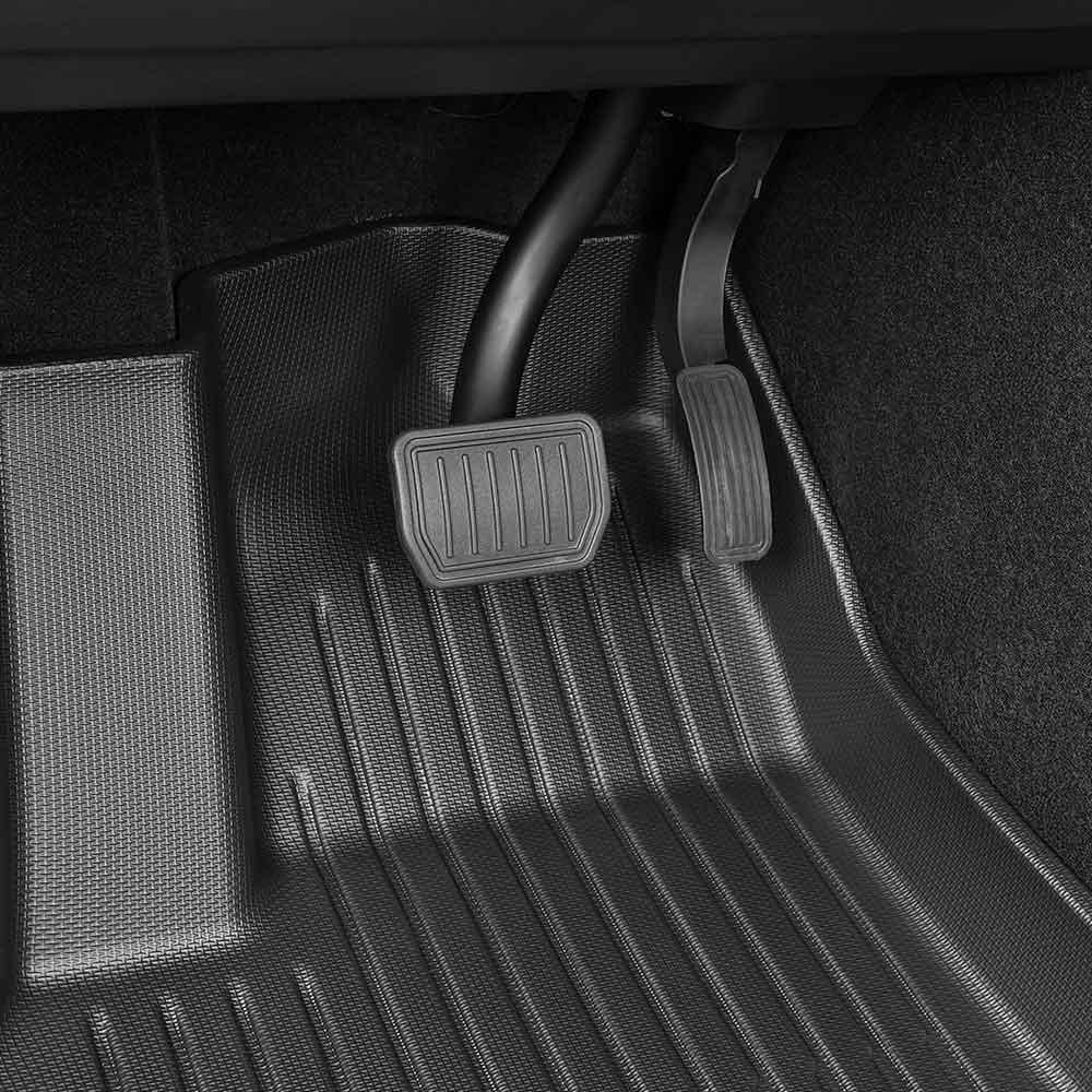 3D all-weather TPE floor mats installed across the front cabin of Model Y