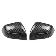 Glossy carbon-fibre-look rear view mirror covers for Tesla Model 3 (2021–2026), displayed as a pair on a white background.
