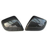 Glossy carbon-fiber-look rear view mirror covers for Tesla Model Y (2025 Juniper), displayed as a pair on a white background.