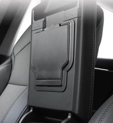 Armrest secret compartment installed beneath the centre armrest of Model 3 and Model Y