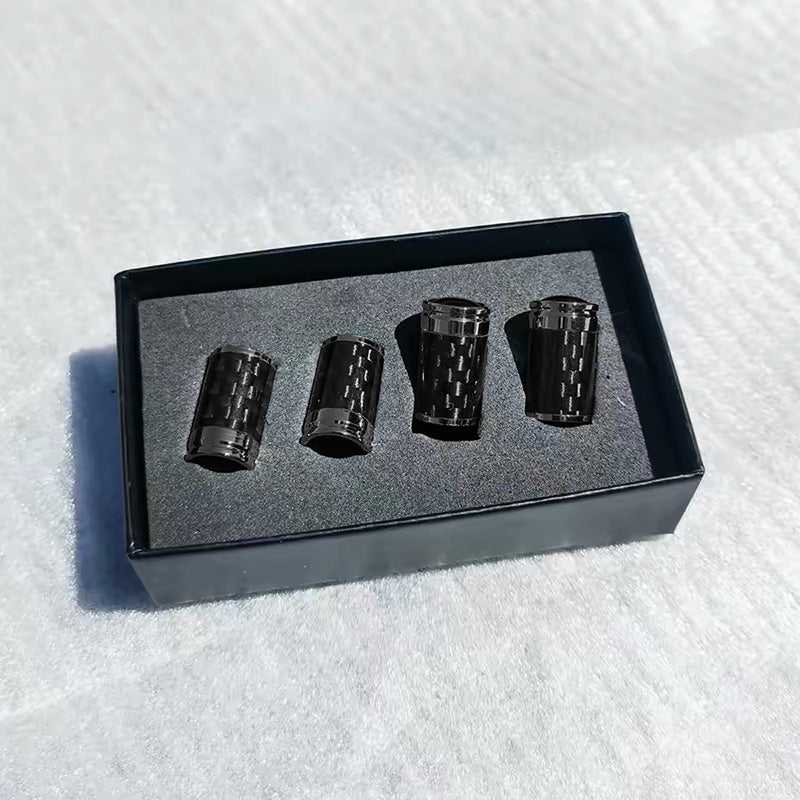 Carbon fibre tyre valve stem caps in presentation box