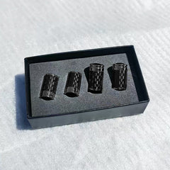Carbon fibre tyre valve stem caps in presentation box