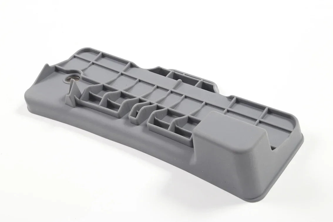 Bottom view of the TPE dashboard screen rear storage tray with reinforced structure
