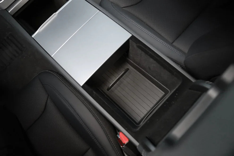 Lower armrest organiser liner providing organised storage inside the centre console