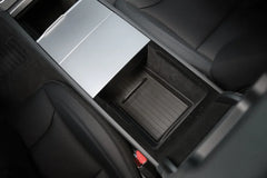 Lower armrest organiser liner providing organised storage inside the centre console