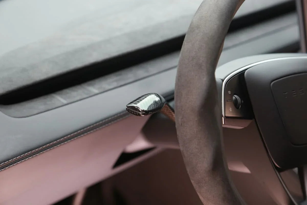 ABS moulded stalk cover installed on the steering column stalk of Model Y
