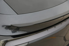 Close-up of the performance spoiler fitted to the rear tailgate of Model Y