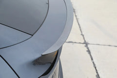 Performance spoiler installed on the rear tailgate of Model Y viewed from the right side