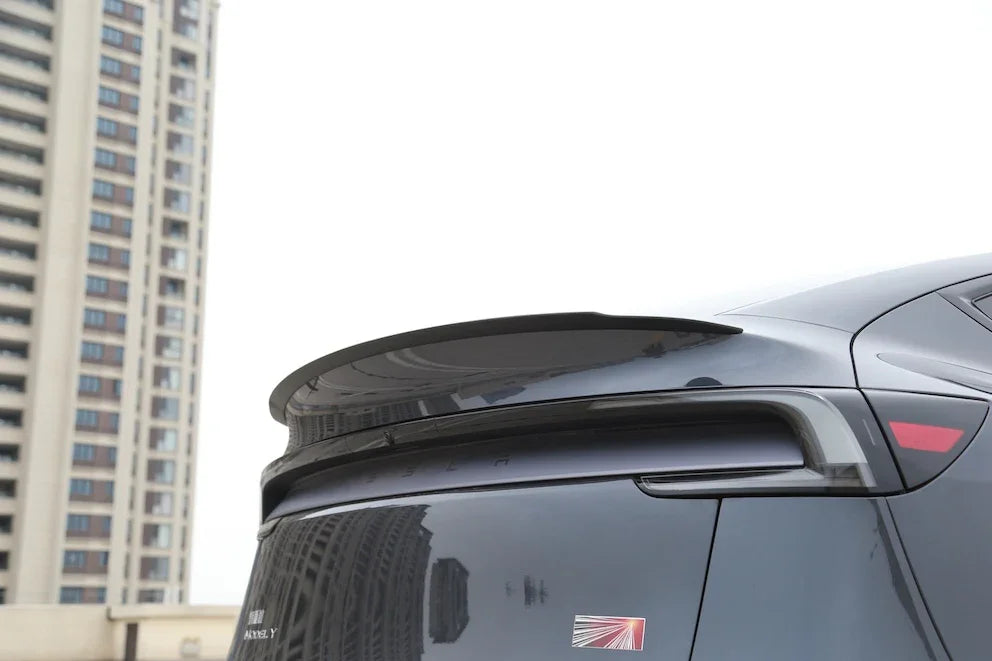 Side view showing the profile of the performance spoiler on Model Y