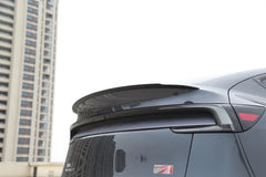 Side view showing the profile of the performance spoiler on Model Y
