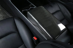 Real carbon fibre armrest cover installed on the centre console