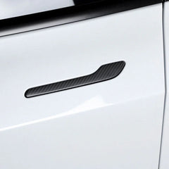 Real carbon fibre door handle wrap cover installed on a white Tesla Model Y or Model 3