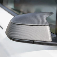 Close-up of the rear view mirror cover installed on Model Y