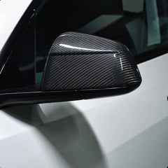 Side view of real carbon fibre rear view mirror covers fitted to Model Y