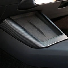 Real carbon fibre wireless phone charger surround installed on the centre console