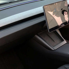 Real carbon fibre charger surround framing the wireless phone charging area during use