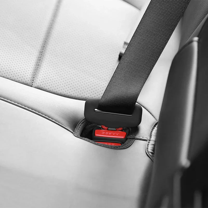 Silicone rear seatbelt buckle cover fitted to the right rear seat buckle