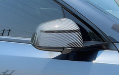 Rear view mirror covers installed on Model Y