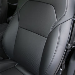 Close-up of the black perforated microfibre leather seat cover for Model Y