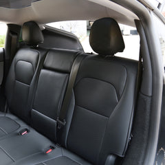 Black microfibre leather rear seat covers installed on Model Y (2025–2026)