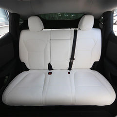 White microfibre leather rear seat covers installed in Model Y (2025–2026)