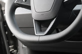 Steering wheel decorative overlay installed on Model 3 (2024–2026) and Model Y (2025–2026)