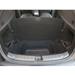 Trunk storage boxes installed in the rear cargo area of Model Y L creating additional hidden storage space