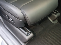 Under seat carpet protectors providing added protection against dirt and wear in Model Y L