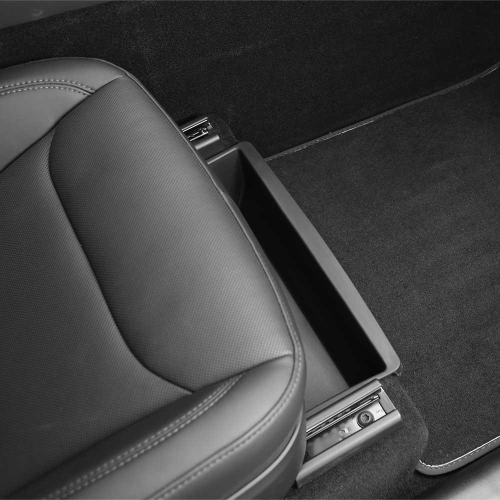 Under seat storage drawer installed beneath the front seat of Model Y L