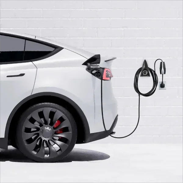 Wall mount charging holder and cable organizer installed beside a Tesla charging station
