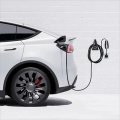 Wall mount charging holder and cable organizer installed beside a Tesla charging station