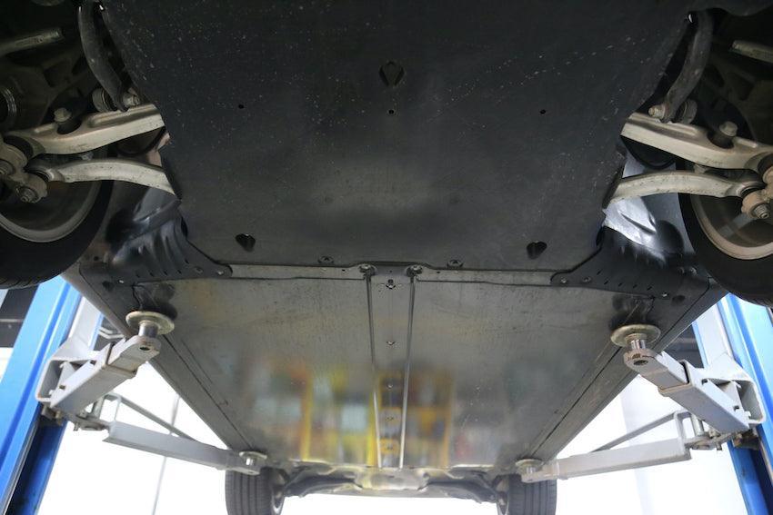 Coolant hose guard plate installed to protect the underside of the Model Y