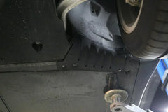 Close-up of the coolant hose guard plate protecting the coolant hose on the Model Y