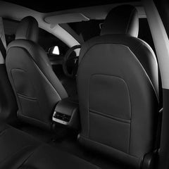 Rear cabin view showing front seat back protectors installed on both front seats