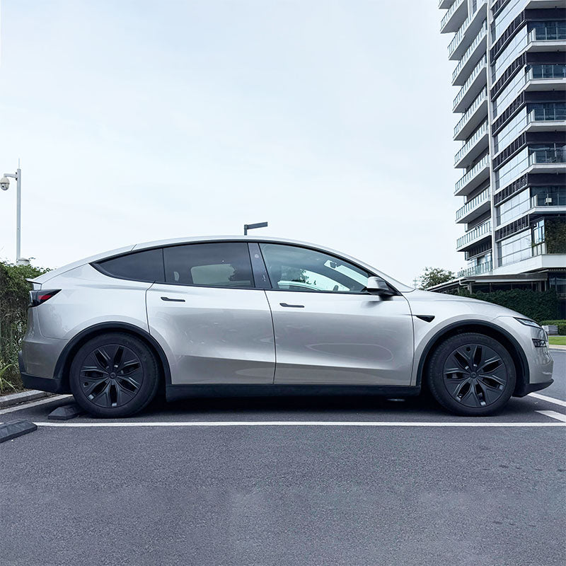 Side view of Model Y L fitted with 19-inch matt black aero wheel covers