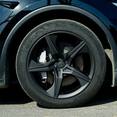 19-inch Starfish Style wheel cover installed on the front wheel of Model Y