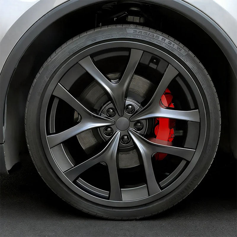 21-inch Performance induction wheel protector installed on Model Y