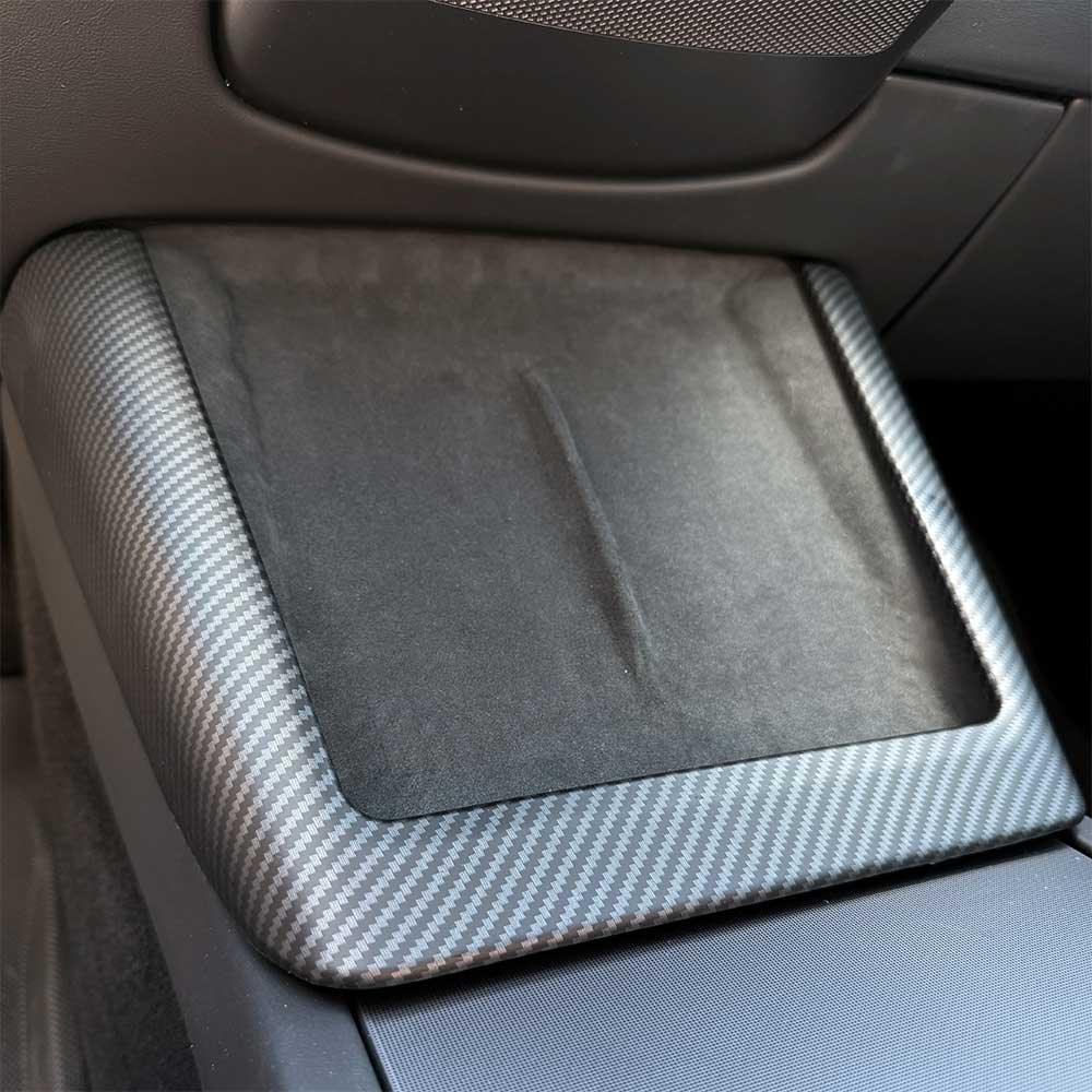 Precision-fit real carbon fibre surround protecting the wireless charging area