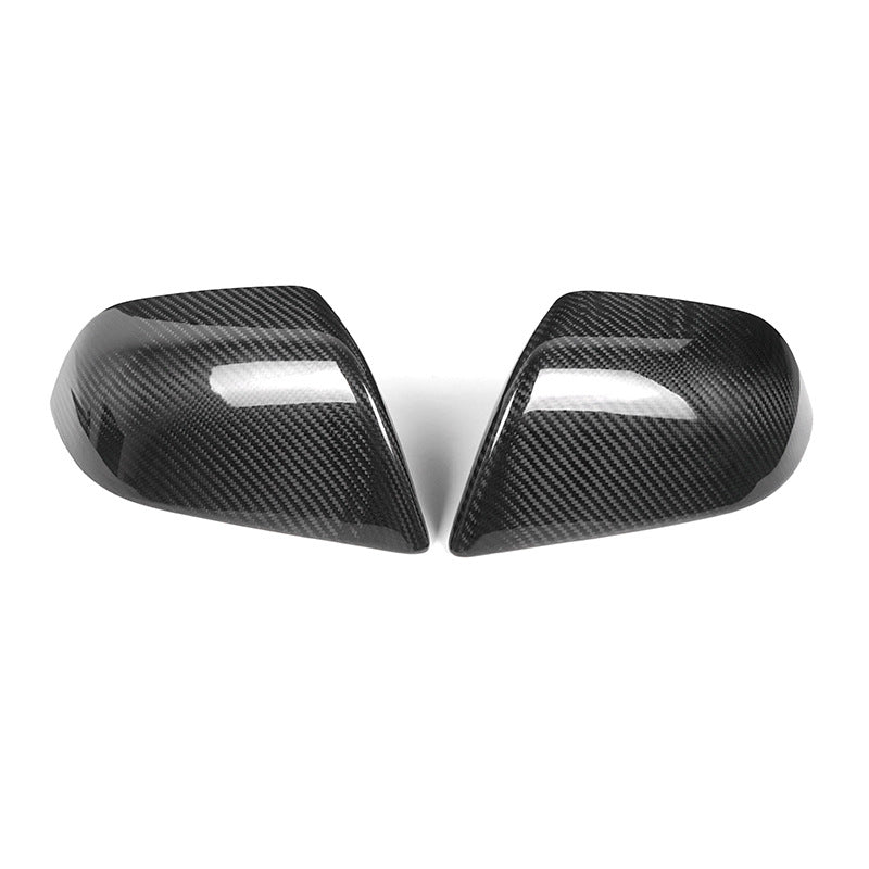 Genuine carbon fibre rear view mirror covers for the 2024 Tesla Model 3 Highland, shown as a high-gloss pair against a white background.