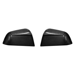 Genuine carbon fibre rear view mirror covers for the 2025 Tesla Model Y Juniper, shown as a high-gloss pair on a white background.
