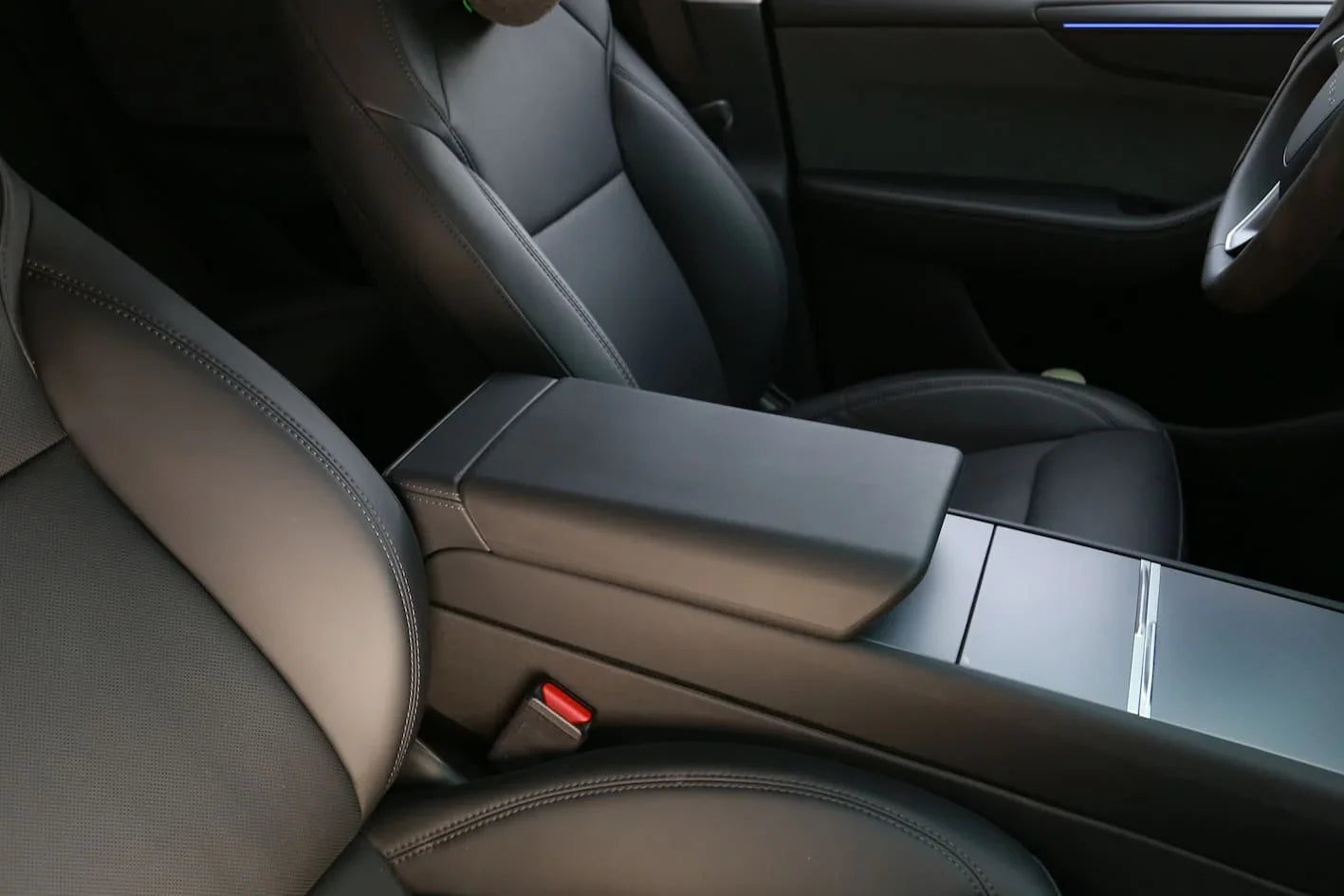 Armrest protector installed on the center console of Model 3 and Model Y