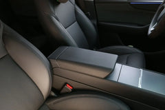 Armrest protector installed on the center console of Model 3 and Model Y