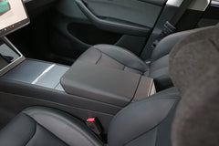 Interior view showing the armrest protector fitted in Model 3 and Model Y