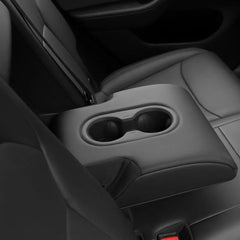 Rear centre armrest with the silicone cup holder insert fitted in Model Y