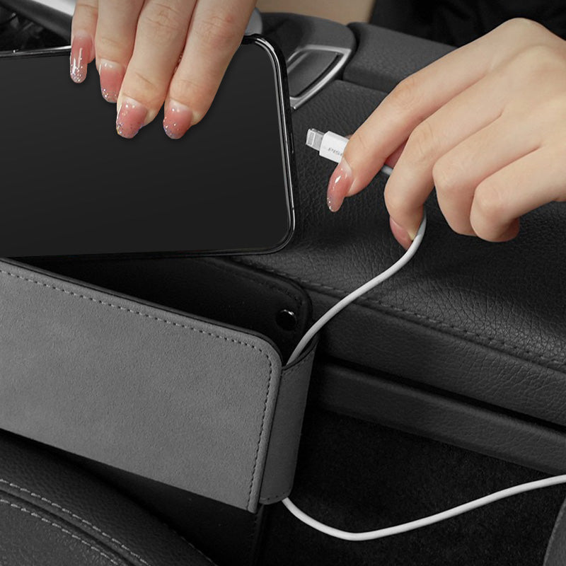 Using the car seat gap filler pocket organizer for easy access to personal items