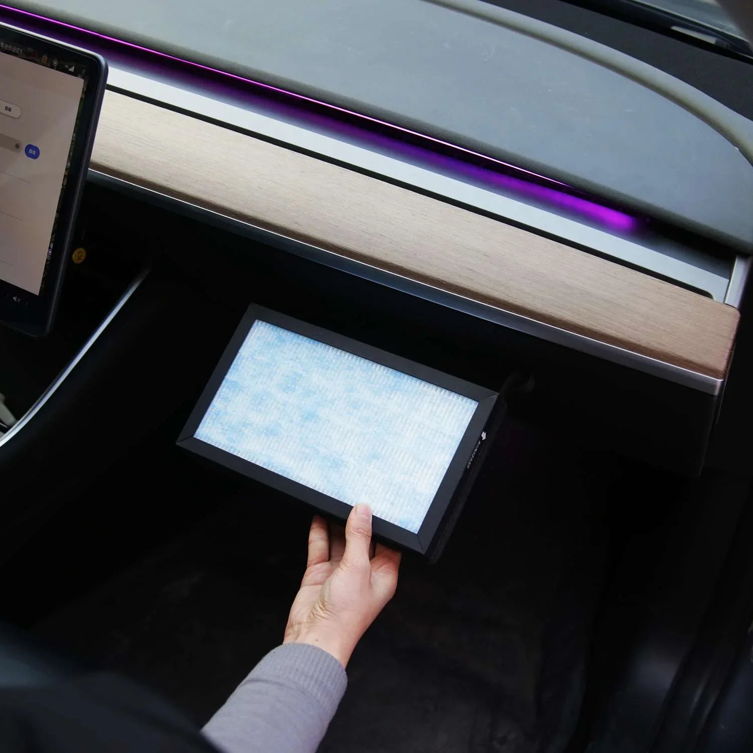 Carbon cabin air filter installed behind the dashboard glovebox area