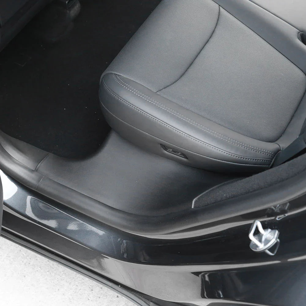 Rear door sill protector installed on Model Y
